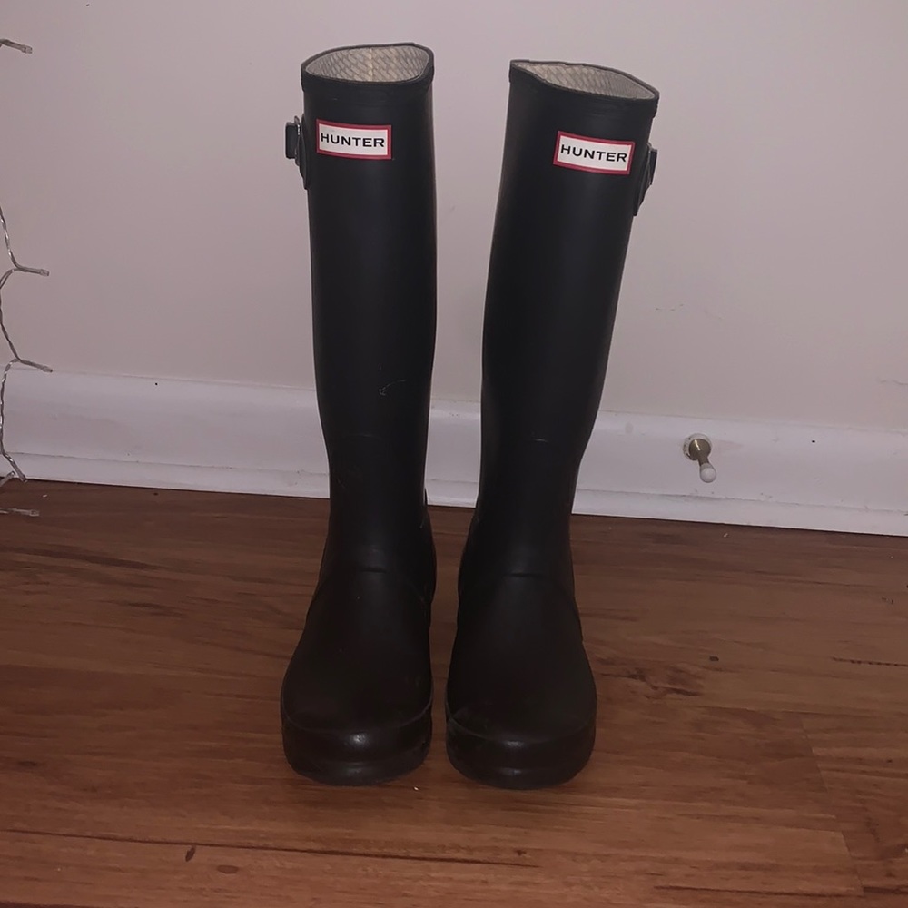 Black tall HUNTER rain boots with white socks